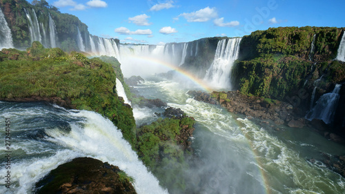 Fototapeta Naklejka Na Ścianę i Meble -  Iguazu Falls and rainbow on the Iguacu River. Located between Argentina and Brazil. Largest waterfalls system in the world.