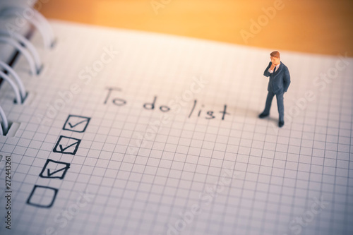 Businessman thinking with to do list