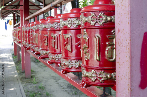 Prayer wheel in the Buddhist temple © Christina