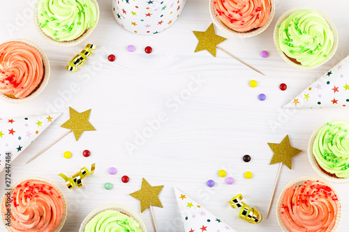 Tasty colorful cupcakes closeup with copy space. Birthday party sweets. Happy birthday greeting card