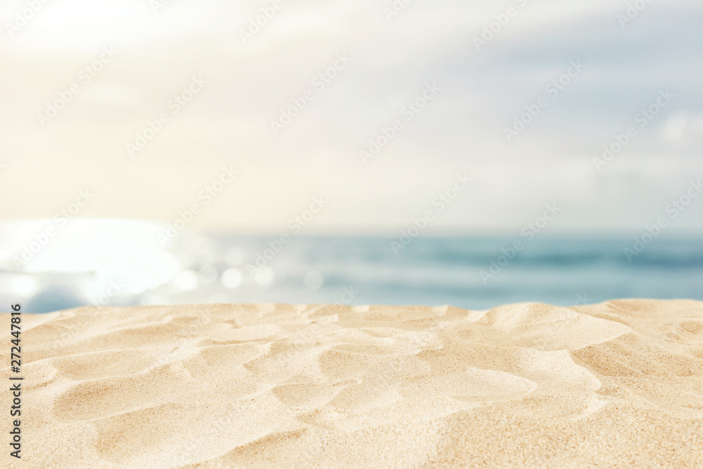 Empty sand beach in front of summer sea background with copy space - obrazy, fototapety, plakaty 