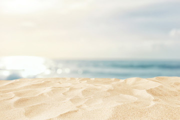 Empty sand beach in front of summer sea background with copy space
