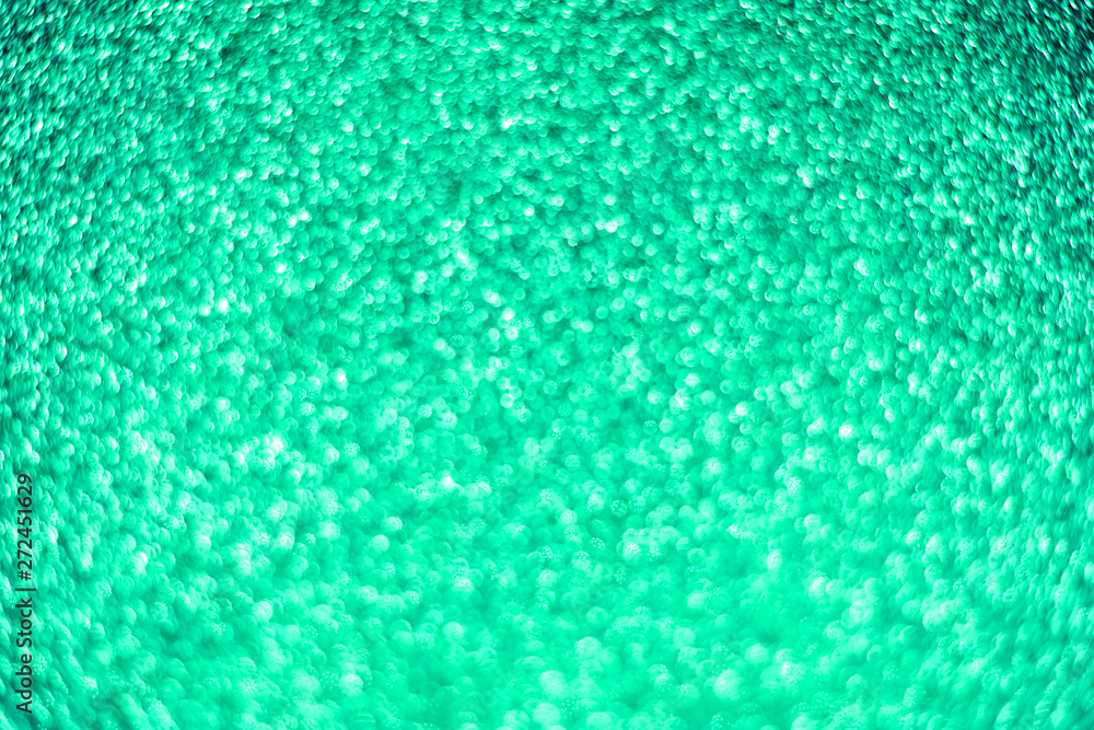 Obraz premium Bright sparkle aquamarine background. Holiday and festive concept.
