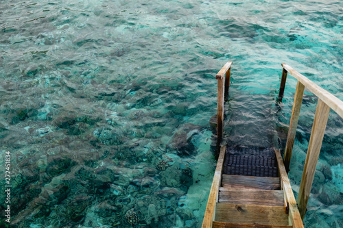 Stairs of a water bungalow in the Maldives © Attaphon