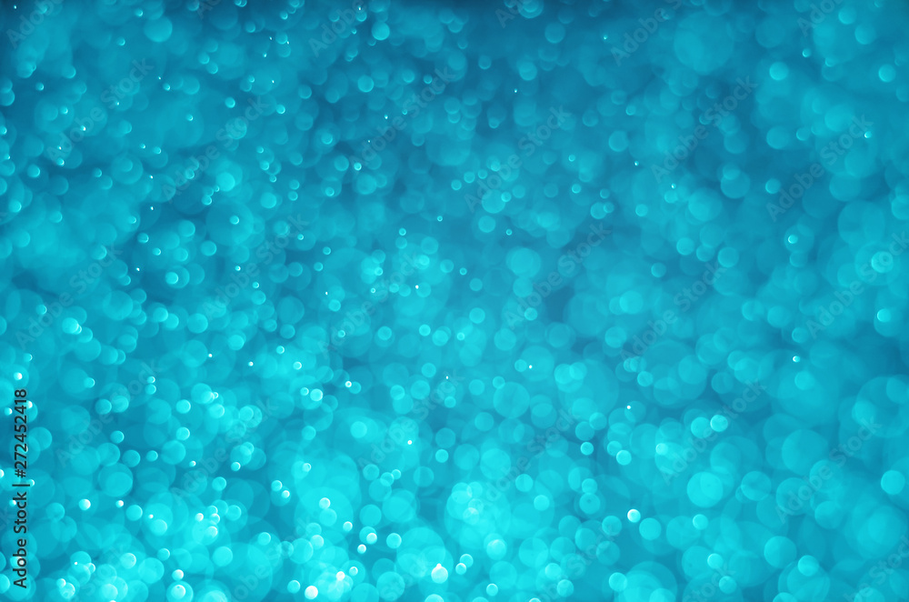 blue aqua bokeh glitter sparkle abstract background.