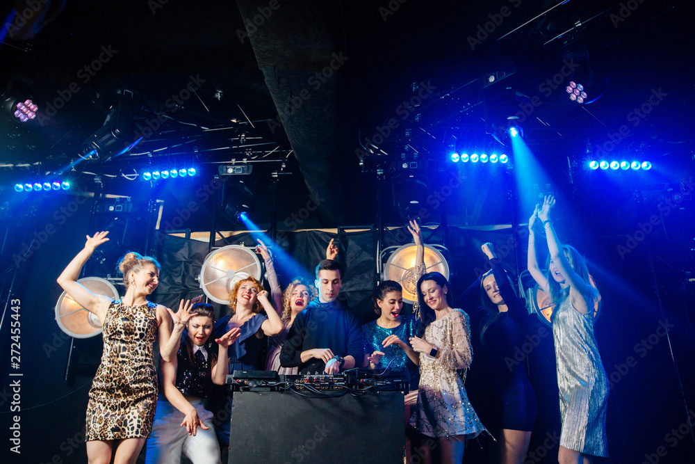 Group of eight emotional sexy women dancing and flirting with the dj in a  night club. Candid picture. Holidays, celebration, nightlife and people  concept. Stock Photo | Adobe Stock