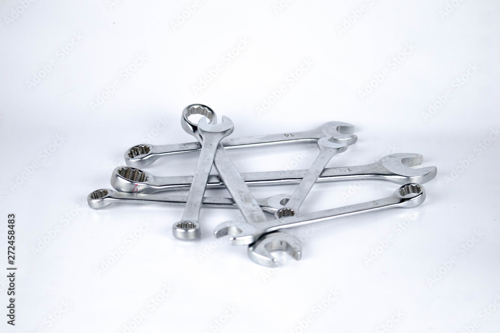 set of combination wrench various size in white isolated background photo close up set of combination wrench various size in white isolated background photo close up