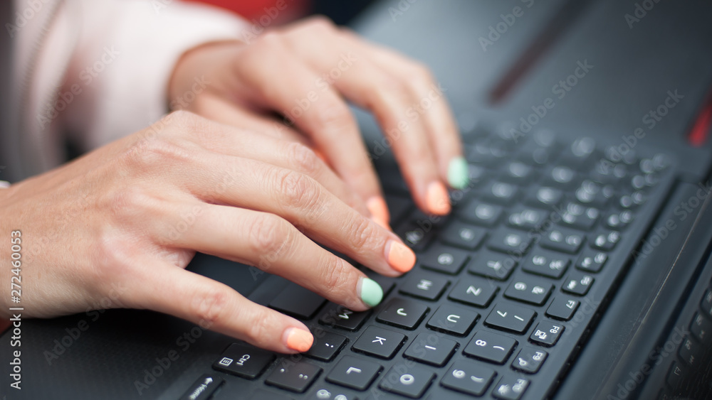 Close up of woman hand, blogger freelancer with computer laptop Close up of woman hand, blogger freelancer with computer laptop