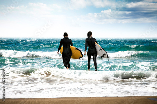 Summer time on beach and surfers. Free space for your decoration 