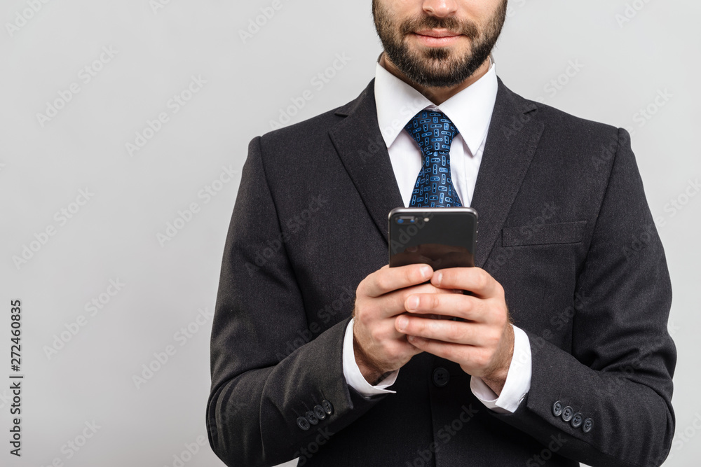 Handsome confident businessman wearing suit standing Handsome confident businessman wearing suit standing