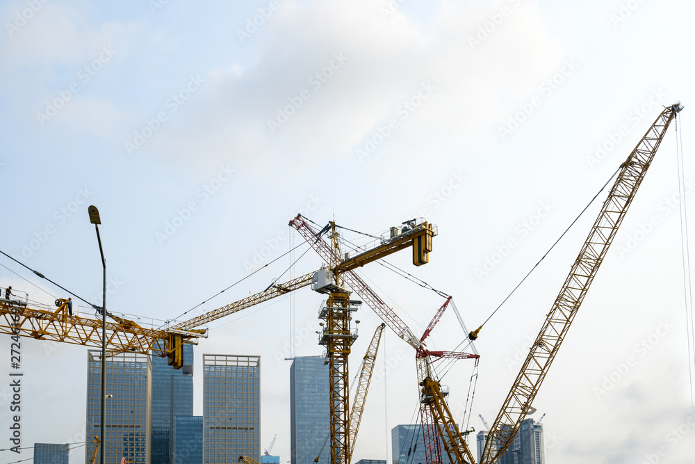 Tower cranes, skyscrapers on construction sites
