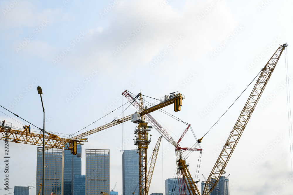 Tower cranes, skyscrapers on construction sites Tower cranes, skyscrapers on construction sites