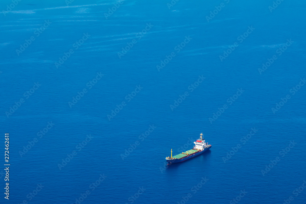Cyprus. Cargo ship on the water view from a height. Mediterranean sea. Cyprus Navy. Sea routes of supply