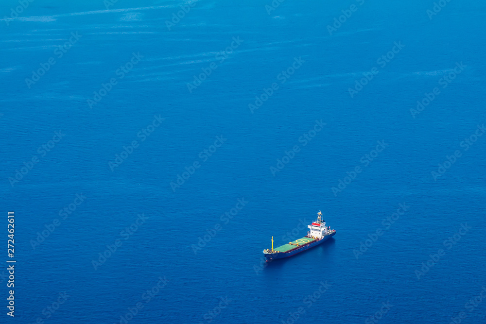 Cyprus. Cargo ship on the water view from a height. Mediterranean sea. Cyprus Navy. Sea routes of supply Cyprus. Cargo ship on the water view from a height. Mediterranean sea. Cyprus Navy. Sea routes of supply
