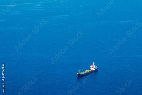 Cyprus. Cargo ship on the water view from a height. Mediterranean sea. Cyprus Navy. Sea routes of supply © Grispb