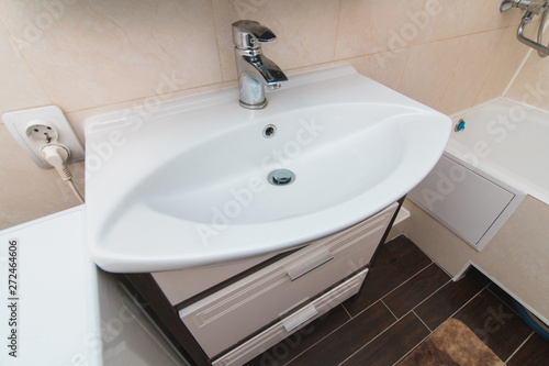 The photo of a sink in a bathroom