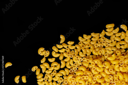 Pasta horns on a black background close-up macro