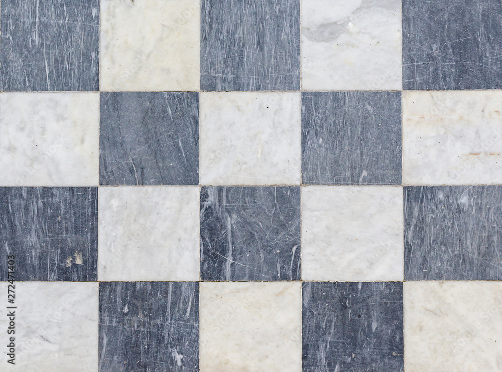Fototapeta premium Texture black and white checkered floor tiles, background.