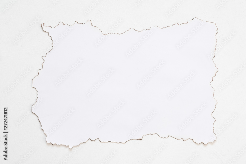 Flat lay of paper mockup on white surface. After fire contour. Abstract background. Copy space. Flat lay of paper mockup on white surface. After fire contour. Abstract background. Copy space.