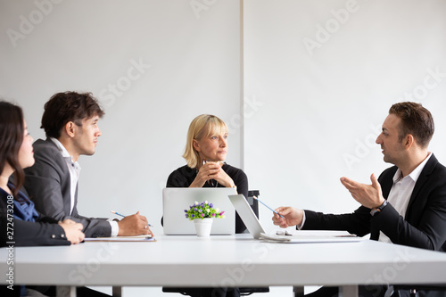 Annual sales summary meeting with manager, secretary and translator in the room office, Collaboration of Asian and European companies, International company