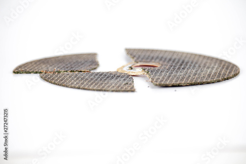 broken cracked cutting wheels abrasive disc isolated white background photo close up side view