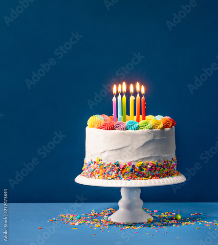 Colorful Birthday Cake over Blue photo