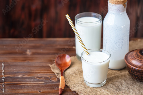 Homemade kefir, yogurt with probiotics in a glass on table Probiotic cold fermented dairy drink Trendy food and drink Copy space Rustic style. photo