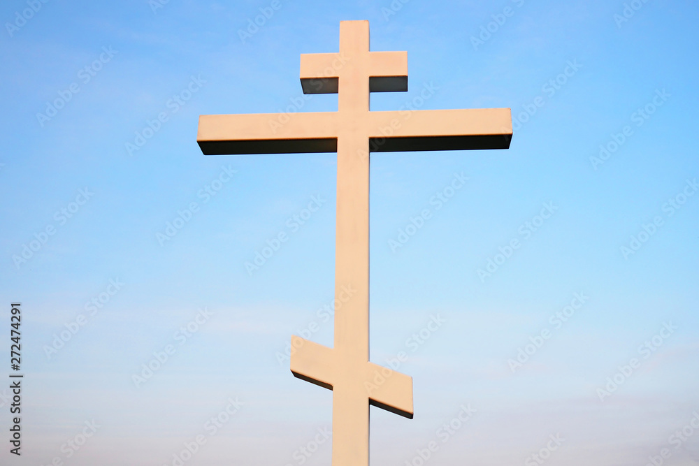 Christian cross against blue sky