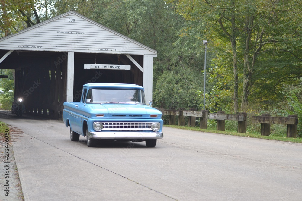 classic car show with covered bridge