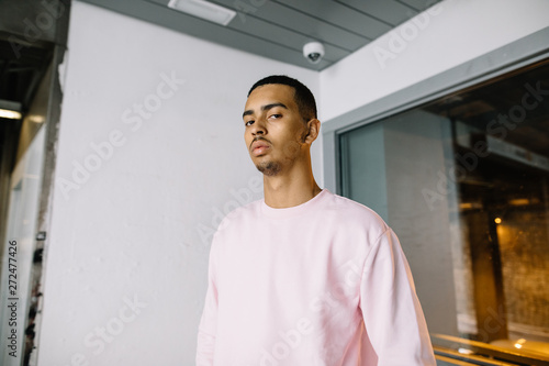 Serious black man looking at camera photo