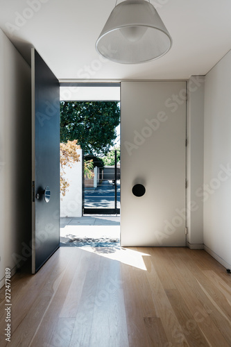 Luxury home entry foyer with grand double front doors