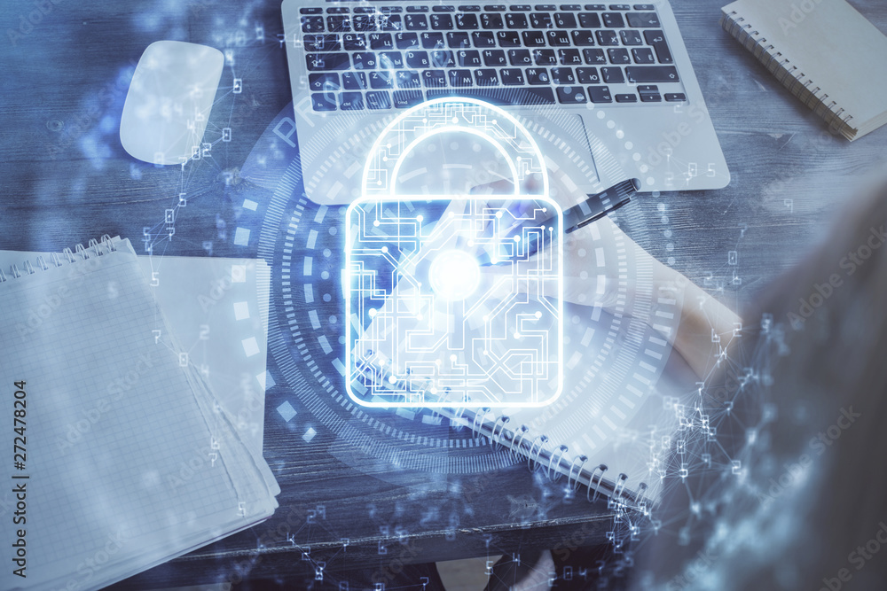 Double exposure of woman's hands writing with lock icon. Concept of security and protection of data Double exposure of woman's hands writing with lock icon. Concept of security and protection of data