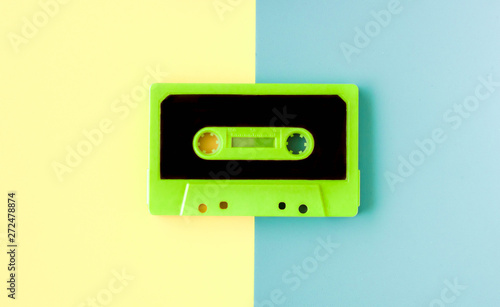 old cassette for tape recorder in happy pastel colors background