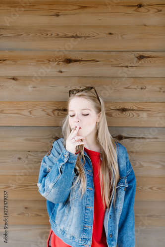 Young woman smoking and enjoy free time at park. photo