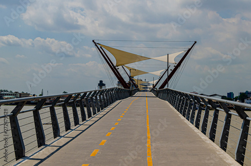 modern pedestrian bridge over the river guayas.guayaquil ecuador photo