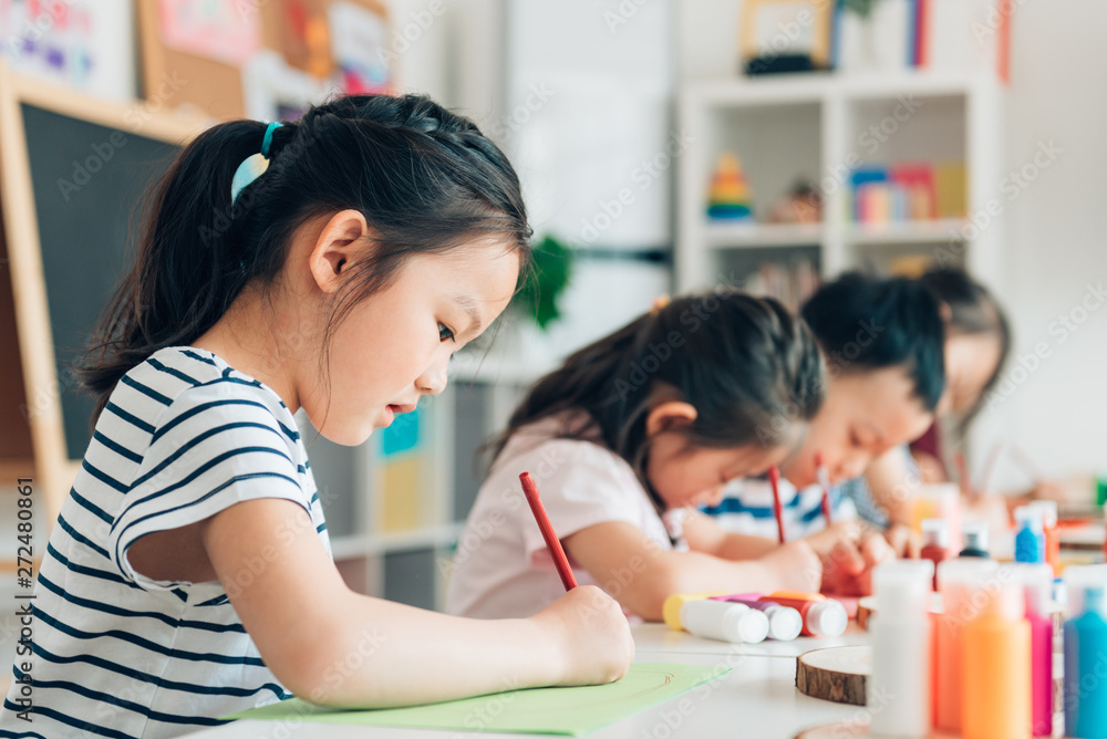 Preschool kids painting in classroom Preschool kids painting in classroom
