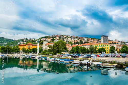 Rijeka, Croatia: Rjecina river with Liberation Monument, boats and view over the city and Trsat castle photo