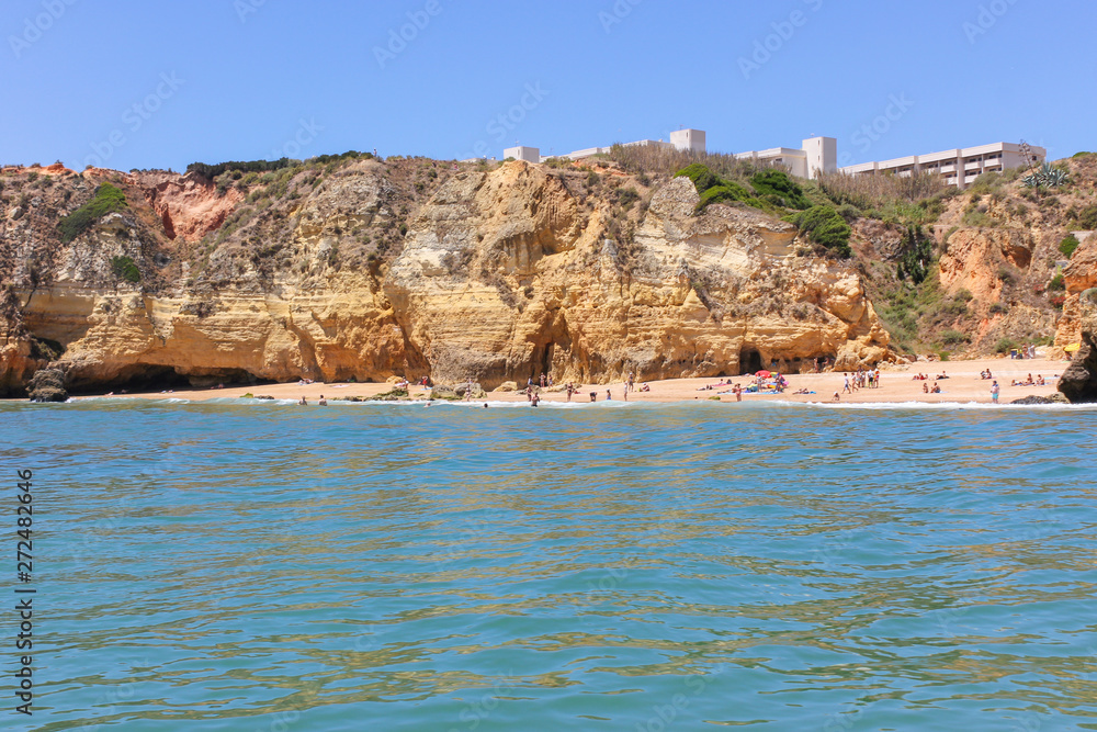 Panoramic landscape view of golden cliffs and emerald water in Ponta da Piedade, Lagos, Algarve, Portugal Panoramic landscape view of golden cliffs and emerald water in Ponta da Piedade, Lagos, Algarve, Portugal