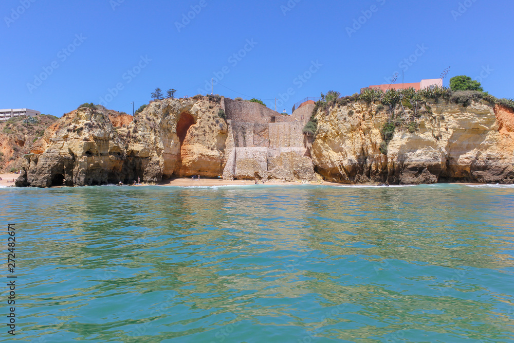 Panoramic landscape view of golden cliffs and emerald water in Ponta da Piedade, Lagos, Algarve, Portugal Panoramic landscape view of golden cliffs and emerald water in Ponta da Piedade, Lagos, Algarve, Portugal
