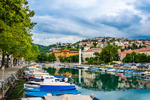 Rijeka, Croatia: Rjecina river with Liberation Monument, boats and view over the city and Trsat castle photo