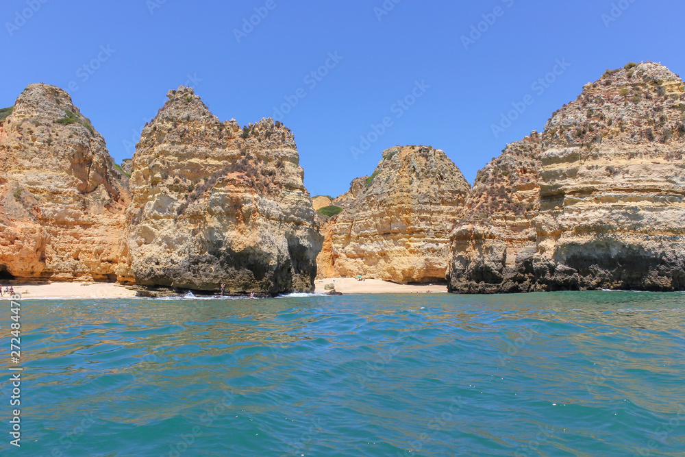 Panoramic landscape view of golden cliffs and emerald water in Ponta da Piedade, Lagos, Algarve, Portugal Panoramic landscape view of golden cliffs and emerald water in Ponta da Piedade, Lagos, Algarve, Portugal