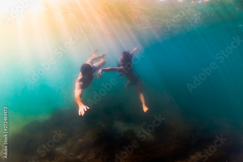 Wallpaper Mural Man and woman do romantic intimate underwater dance Torontodigital.ca