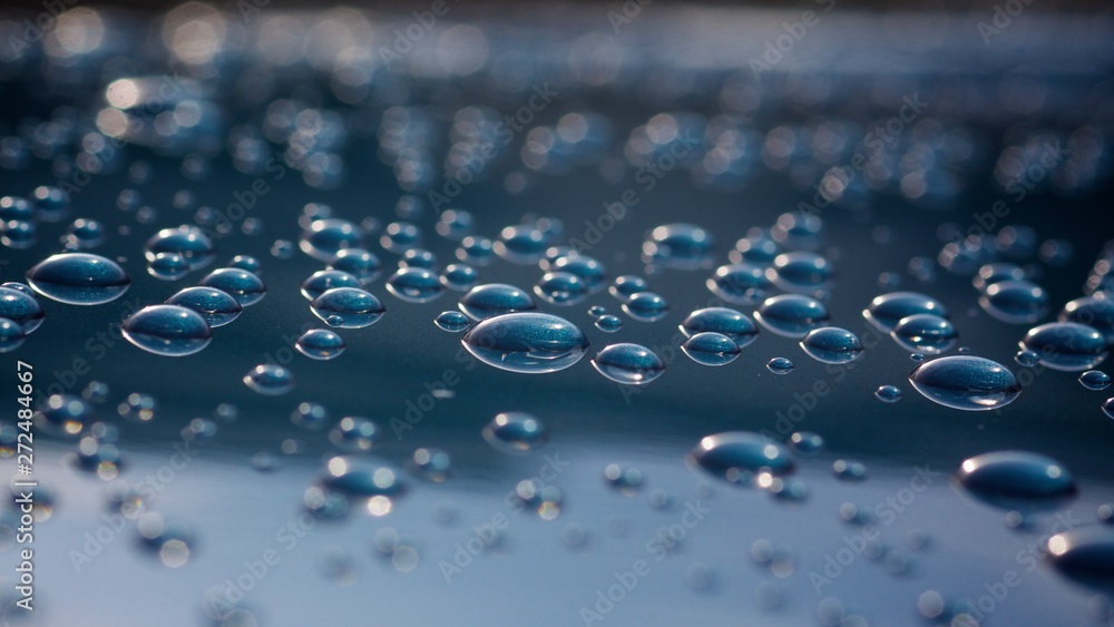 Water Droplets on a freshly waxed vehicle. Stock Photo Adobe Stock