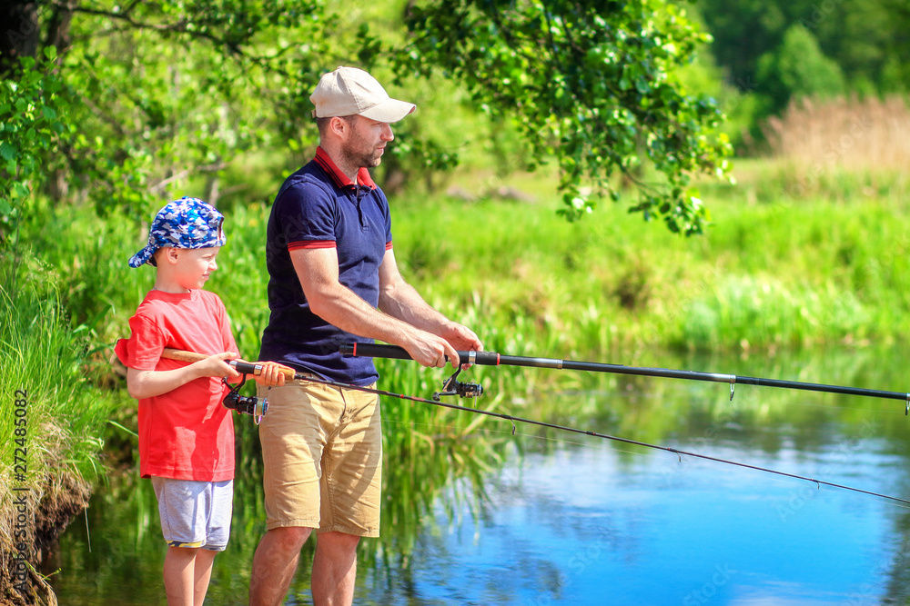 Family fishing. Father and son on fishing. Parent and child on riverside catching fish