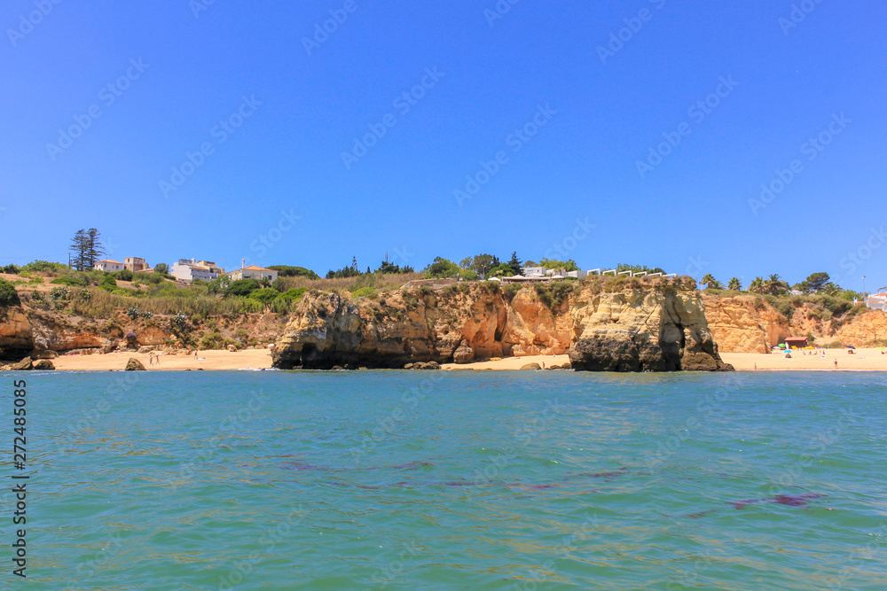 Panoramic landscape view of golden cliffs and emerald water in Ponta da Piedade, Lagos, Algarve, Portugal Panoramic landscape view of golden cliffs and emerald water in Ponta da Piedade, Lagos, Algarve, Portugal