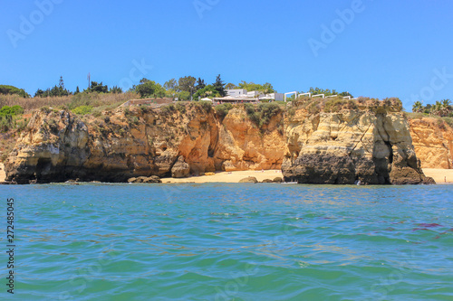 Panoramic landscape view of golden cliffs and emerald water in Ponta da Piedade, Lagos, Algarve, Portugal © Vitor Miranda