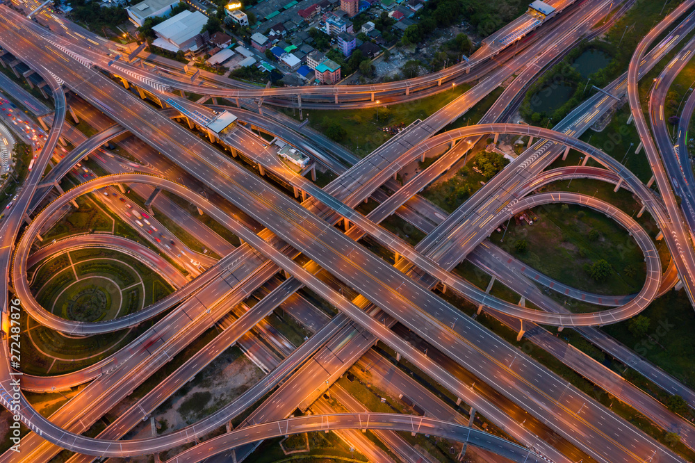 Aerial view of highway at rush hour at night time with car trail and traffic. view from drone Aerial view of highway at rush hour at night time with car trail and traffic. view from drone