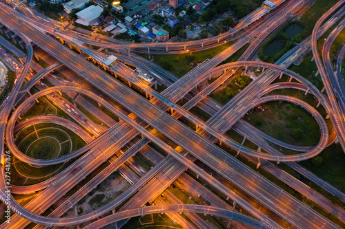 Aerial view of highway at rush hour at night time with car trail and traffic. view from drone