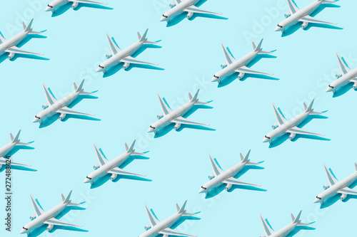 Trendy sunlight Summer pattern made with airplane camera on bright light blue background. Minimal summer concept.