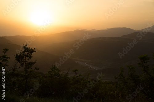 Beautiful landscape in the mountains with the sun at dawn. Mountains at the sunset time. Azerbaijan Caucasus Mountains. Agsu pass. Baskal. Nature